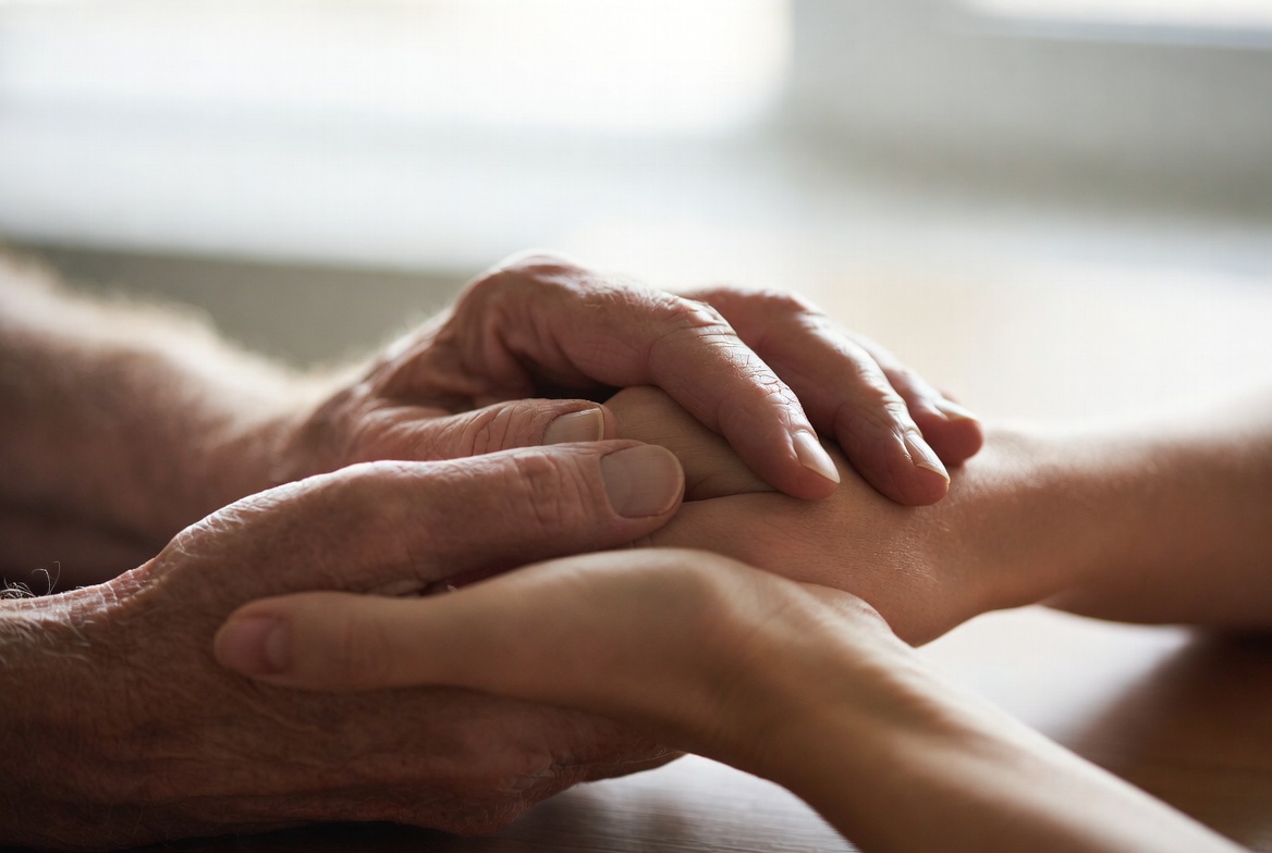 elderly male hands holding hands with daughter. Image created by Grok AI